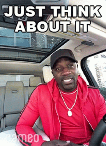 A Man In A Red Jacket Is Sitting In A Car With A Caption That Says Just Think About It . GIF
