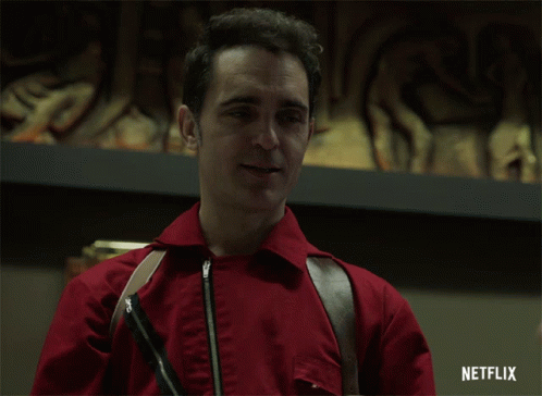 A Man In A Red Jacket Is Smiling With A Netflix Logo In The Corner GIF