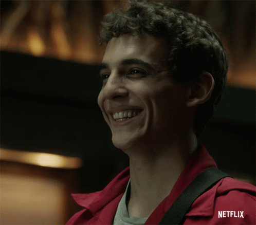 A Man In A Red Jacket Is Smiling With Netflix Written On The Bottom GIF