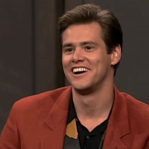 A Man In A Red Jacket Is Smiling With The Words That 'S Really Funny Below Him GIF