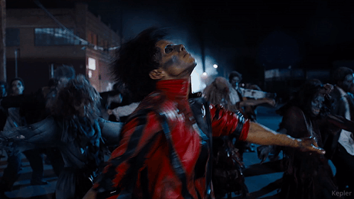 A Man In A Red Jacket Is Surrounded By Zombies And The Word Kepler Is On The Bottom GIF