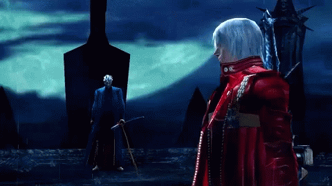 A Man In A Red Jacket Stands In Front Of A Man In A Blue Suit GIF