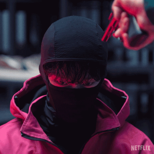 A Man In A Red Jacket With Netflix Written On The Bottom GIF