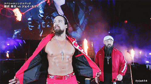 a man in a red jacket with the number 14 on the bottom right