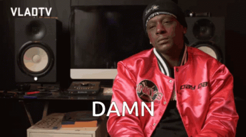 A Man In A Red Jacket With The Word Damn Written On It GIF