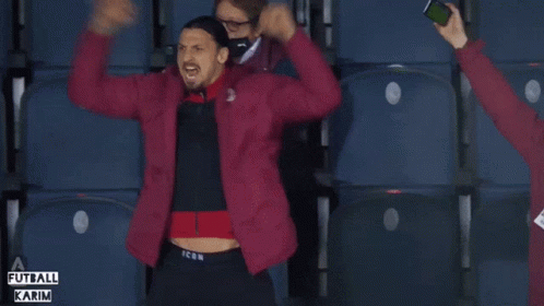 A Man In A Red Jacket With The Word Icon On The Bottom GIF