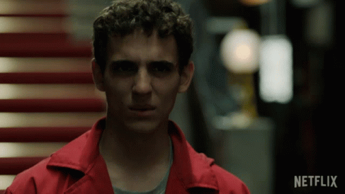 A Man In A Red Jacket With The Word Netflix On The Bottom Right GIF