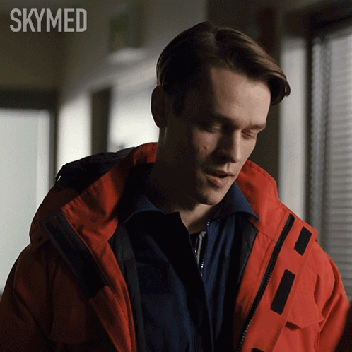 A Man In A Red Jacket With The Word Skymed On The Bottom Right GIF