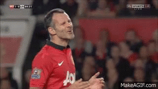 A Man In A Red Jersey With The Letter J On It Is Clapping GIF
