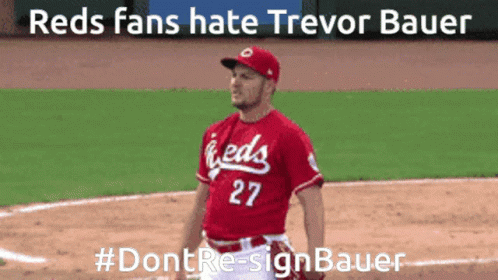A Man In A Red Jersey With The Number 27 Stands On A Baseball Field GIF