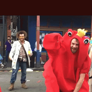 A Man In A Red Lobster Costume Is Dancing GIF