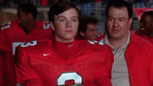 A Man In A Red Nike Jersey With The Number 3 On His Chest GIF