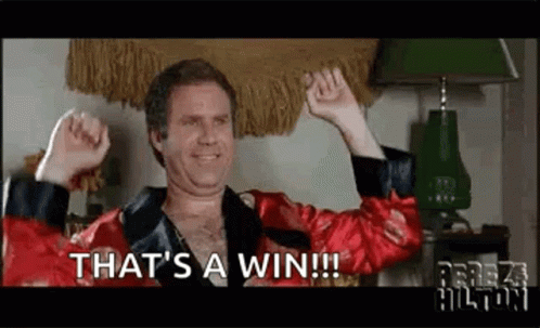 A Man In A Red Robe Is Celebrating With His Arms In The Air And Says `` That 'S A Win ! '' GIF