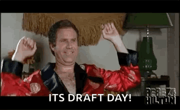 A Man In A Red Robe Is Raising His Arms In The Air And Says `` It 'S Draft Day ! '' GIF