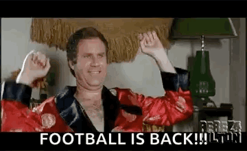 A Man In A Red Robe Is Raising His Fist In The Air While Wearing A Red Robe . GIF
