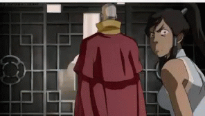 A Man In A Red Robe Is Standing Next To A Woman In A White Shirt . GIF