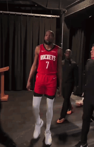 A Man In A Red Rockets Jersey With The Number 7 GIF