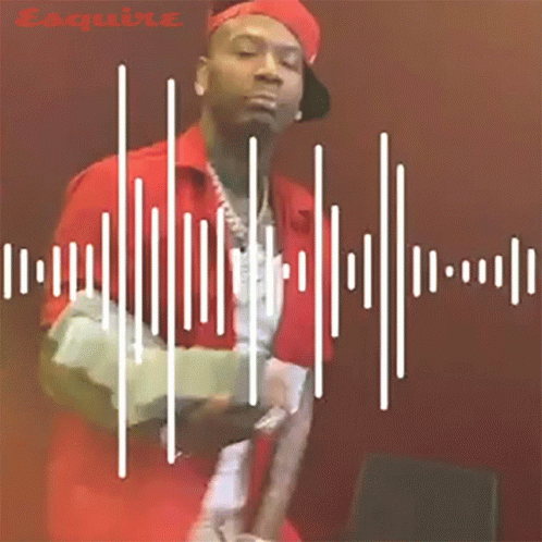 A Man In A Red Shirt And Hat Is Standing In Front Of A Sound Wave GIF