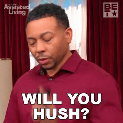 A Man In A Red Shirt Is Asking If Someone Will Hush GIF