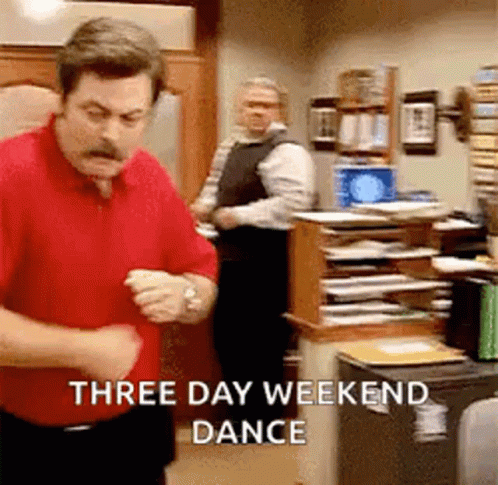 A Man In A Red Shirt Is Dancing In An Office While Another Man Looks On . GIF