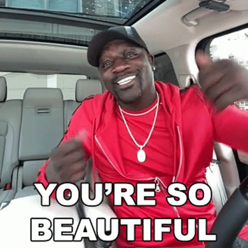 A Man In A Red Shirt Is Giving A Thumbs Up With The Words You 'Re So Beautiful Underneath Him GIF