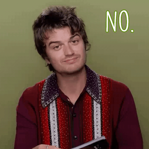 A Man In A Red Shirt Is Holding A Book And Making A No Sign GIF