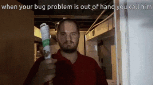 A Man In A Red Shirt Is Holding A Bug Spray In His Right Hand GIF