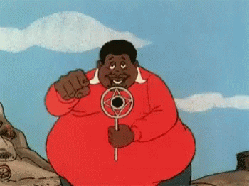 A Man In A Red Shirt Is Holding A Circular Object In His Hands GIF