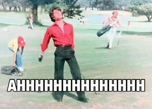 A Man In A Red Shirt Is Holding A Golf Club On A Golf Course With The Words Ahhhh On The Bottom GIF