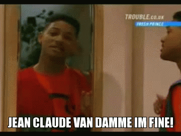 A Man In A Red Shirt Is Looking At Himself In A Mirror And Saying Jean Claude Van Damme Im Fine ! GIF
