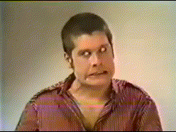 A Man In A Red Shirt Is Making A Face GIF