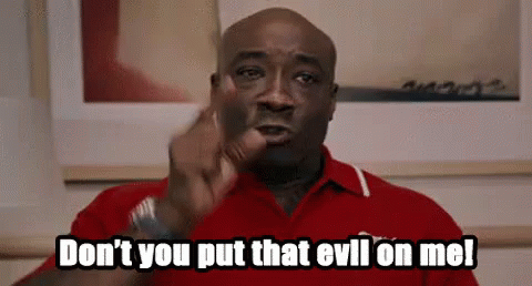 A Man In A Red Shirt Is Pointing At The Camera And Saying `` Don 'T You Put That Evil On Me '' GIF