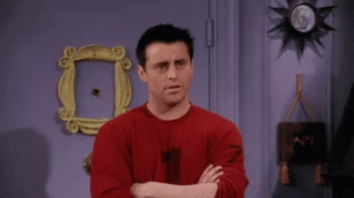 A Man In A Red Shirt Is Pointing At The Camera And Saying You Almost GIF