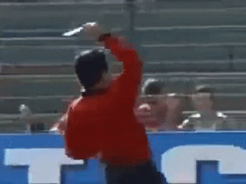 A Man In A Red Shirt Is Running On A Soccer Field In Front Of A Sign That Says Anta GIF