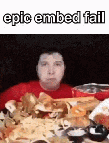 A Man In A Red Shirt Is Sitting At A Table With A Pile Of Nachos . GIF