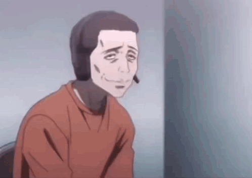 A Man In A Red Shirt Is Sitting In A Chair And Smiling . GIF