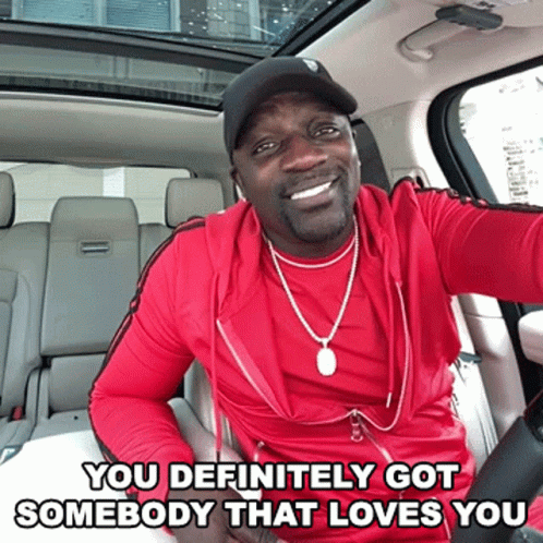 A Man In A Red Shirt Is Sitting In The Back Seat Of A Car With The Words You Definitely Got Somebody That Loves You Belo GIF