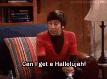 A Man In A Red Shirt Is Sitting On A Couch And Saying Can I Get A Hallelujah . GIF