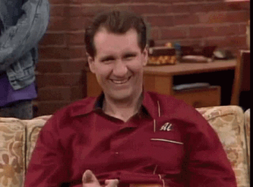 Smiling Man In Red Shirt Giving Thumbs Up GIF