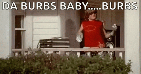 A Man In A Red Shirt Is Standing On A Porch With A Record Player . GIF
