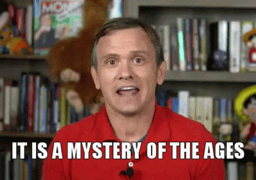 A Man In A Red Shirt Is Talking About A Mystery Of The Ages GIF