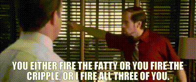 A Man In A Red Shirt Is Talking To Another Man In A White Shirt And Tie .. GIF