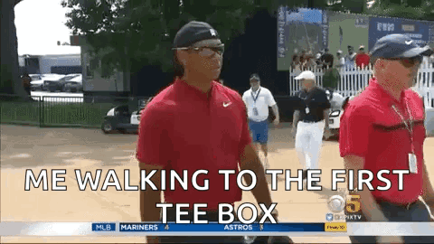 A Man In A Red Shirt Is Walking To The First Tee Box .. GIF