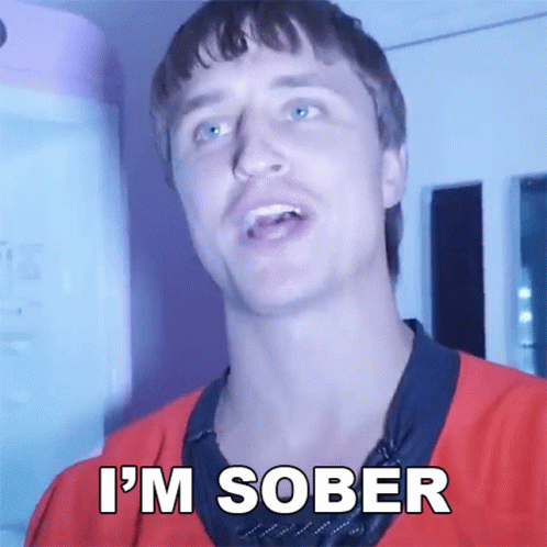 A Man In A Red Shirt Says " I 'M Sober " In White Letters GIF