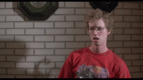 A Man In A Red Shirt Stands In Front Of A Brick Wall And Says " Heck Yes I Did " GIF