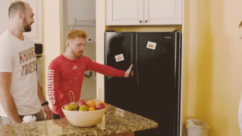 A Man In A Red Shirt That Says Hundred On The Sleeve GIF