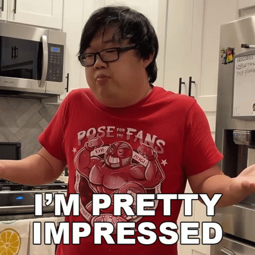 A Man In A Red Shirt That Says Pose For Fans GIF