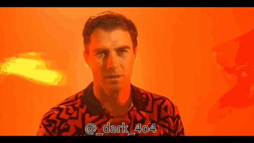 A Man In A Red Shirt With The Hashtag Dark 404 On The Bottom GIF