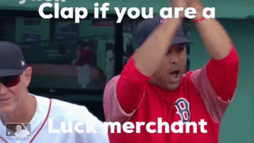 A Man In A Red Shirt With The Letter B On It Is Clapping GIF