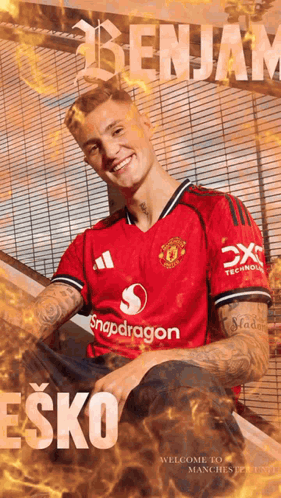 A Man In A Red Shirt With The Name Benjam On It GIF
